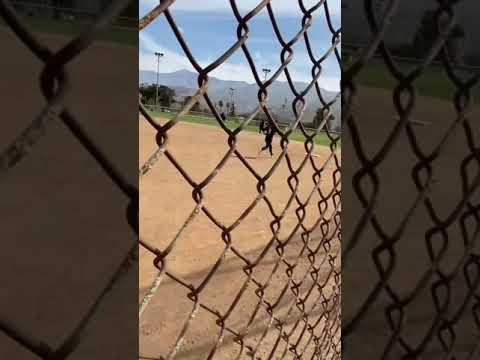 Video of Angelina Tacchia batting (black helmet with face guard)