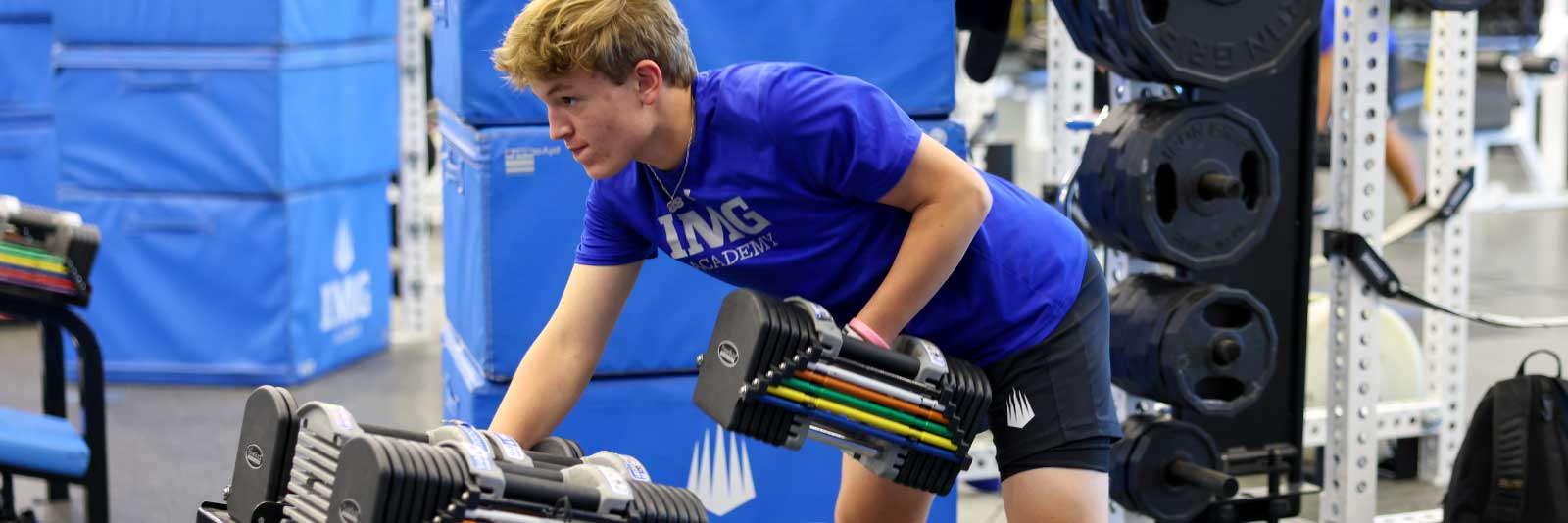 IMG athlete lifting weights