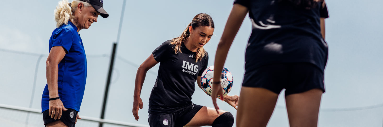 women's soccer player practicing drills